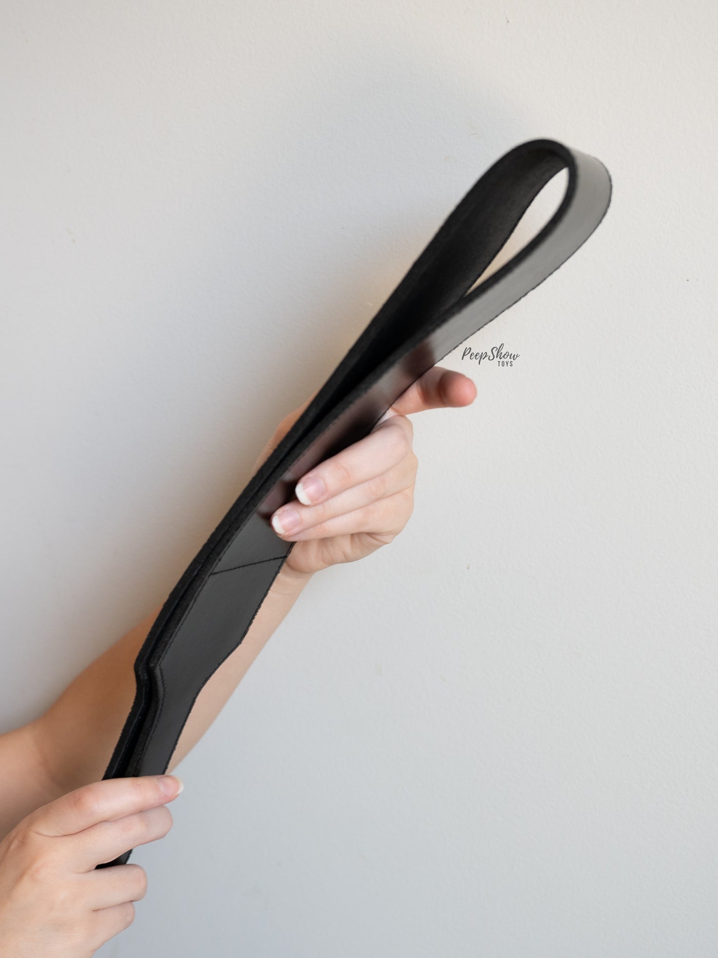 Black Leather Open Folded Paddle in hands