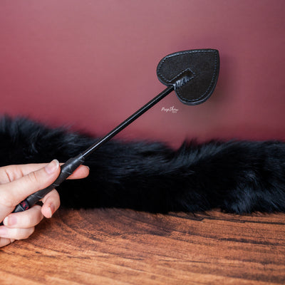 Black Leather Mini Spade Paddle being held
